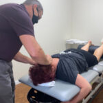 physical therapist working on someone's neck pain