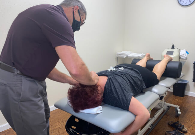 physical therapist working on someone's neck pain